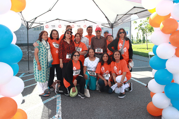 A group of 5K participants pose for a photo before the race begins.