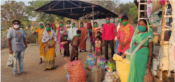Beneficiaries receive masks and groceries as part of our COVID-19 relief efforts. 